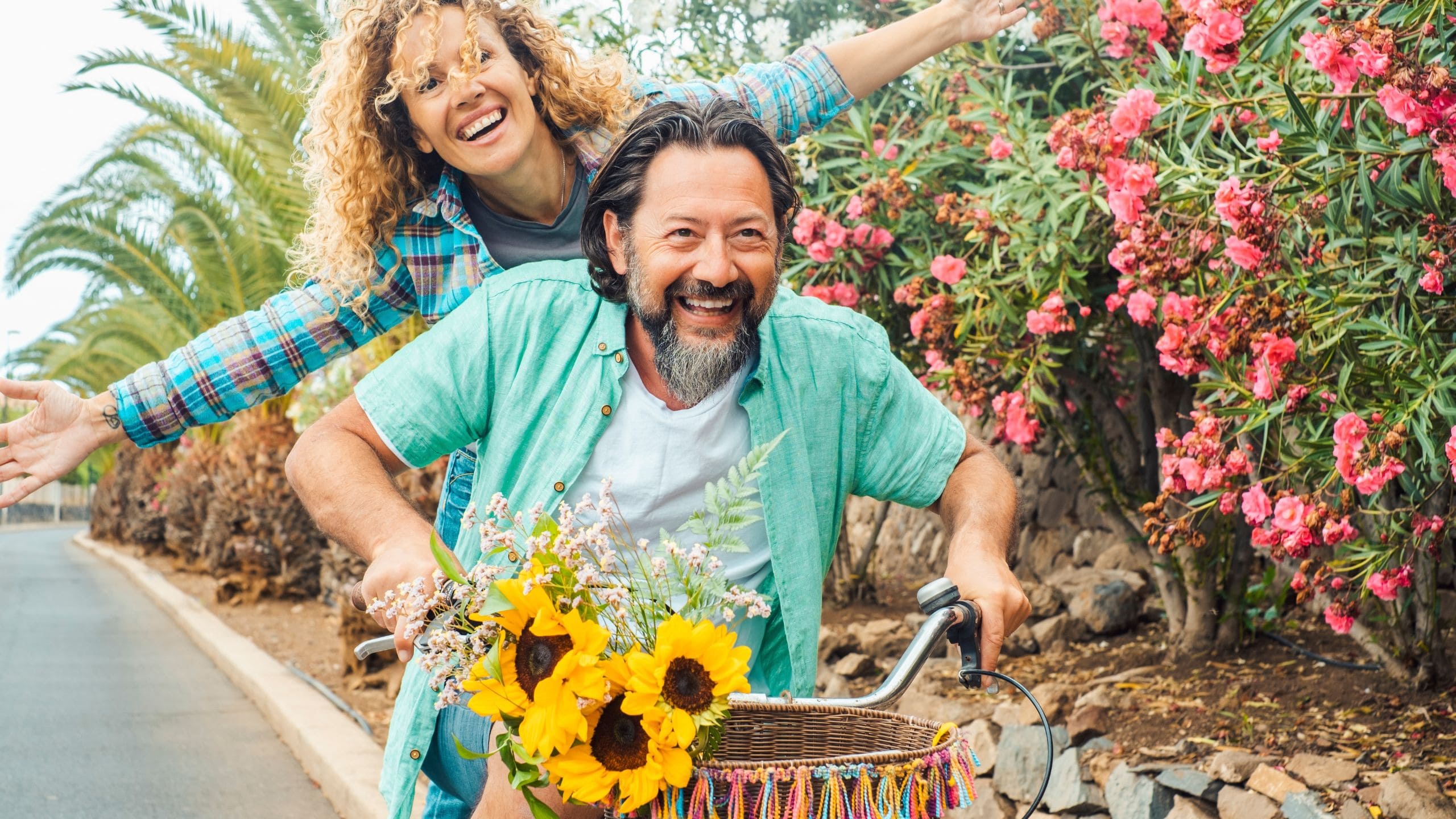 Happy couple enjoying a bike ride after receiving treatment at Rescore clinic for autoimmune diseases